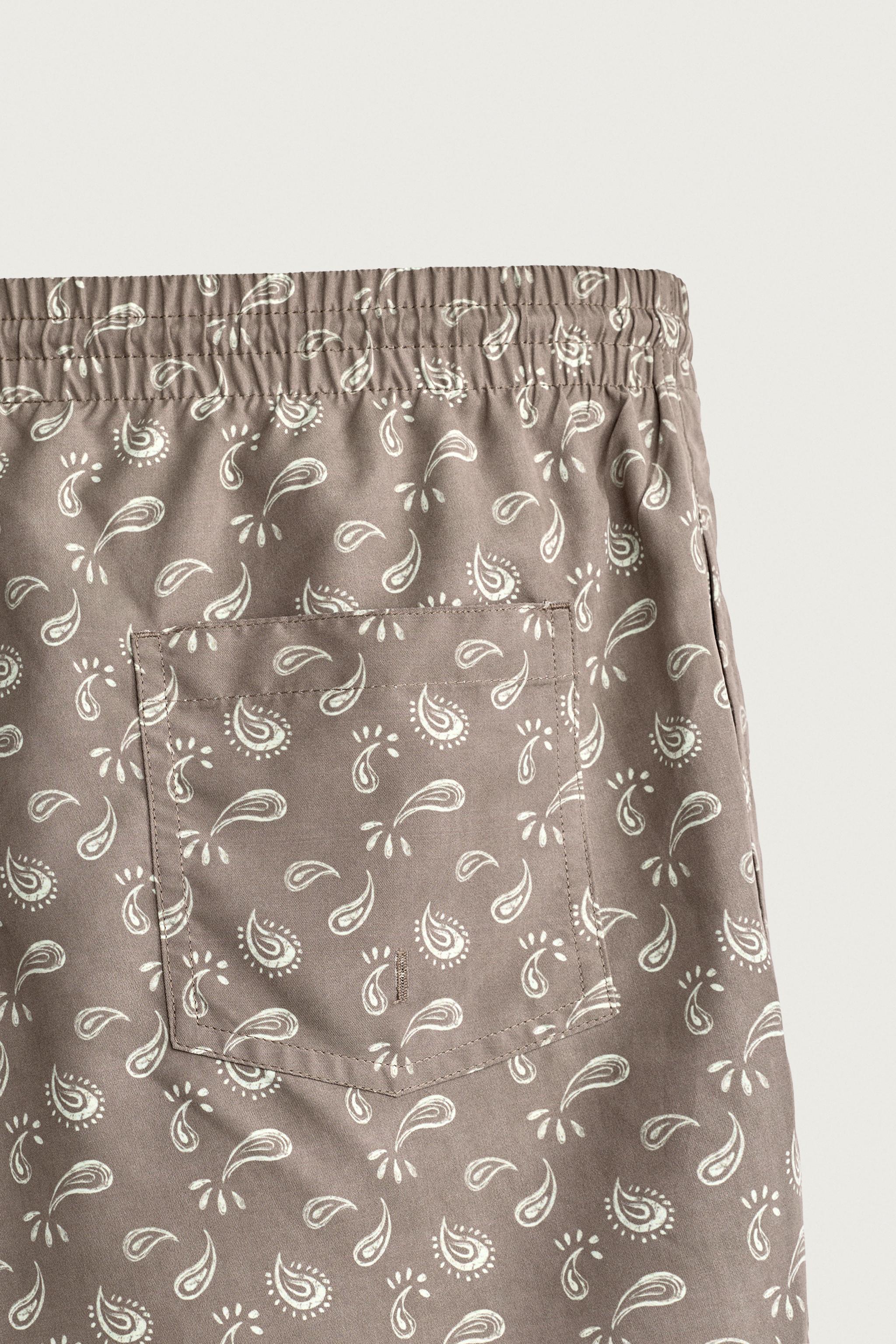 PAISLEY PRINT MID-LENGTH SWIM TRUNKS